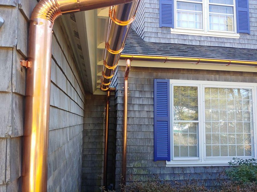 Copper gutters and downspouts on a home