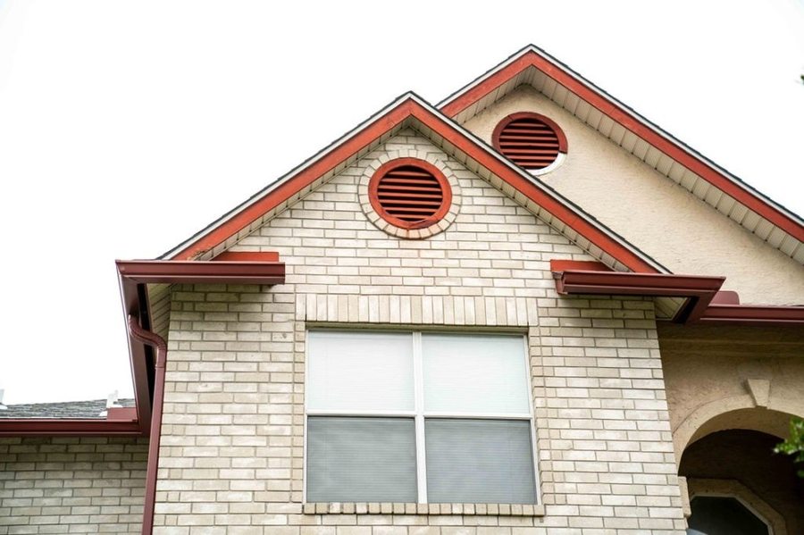 Custom-color gutters matched to a brick home